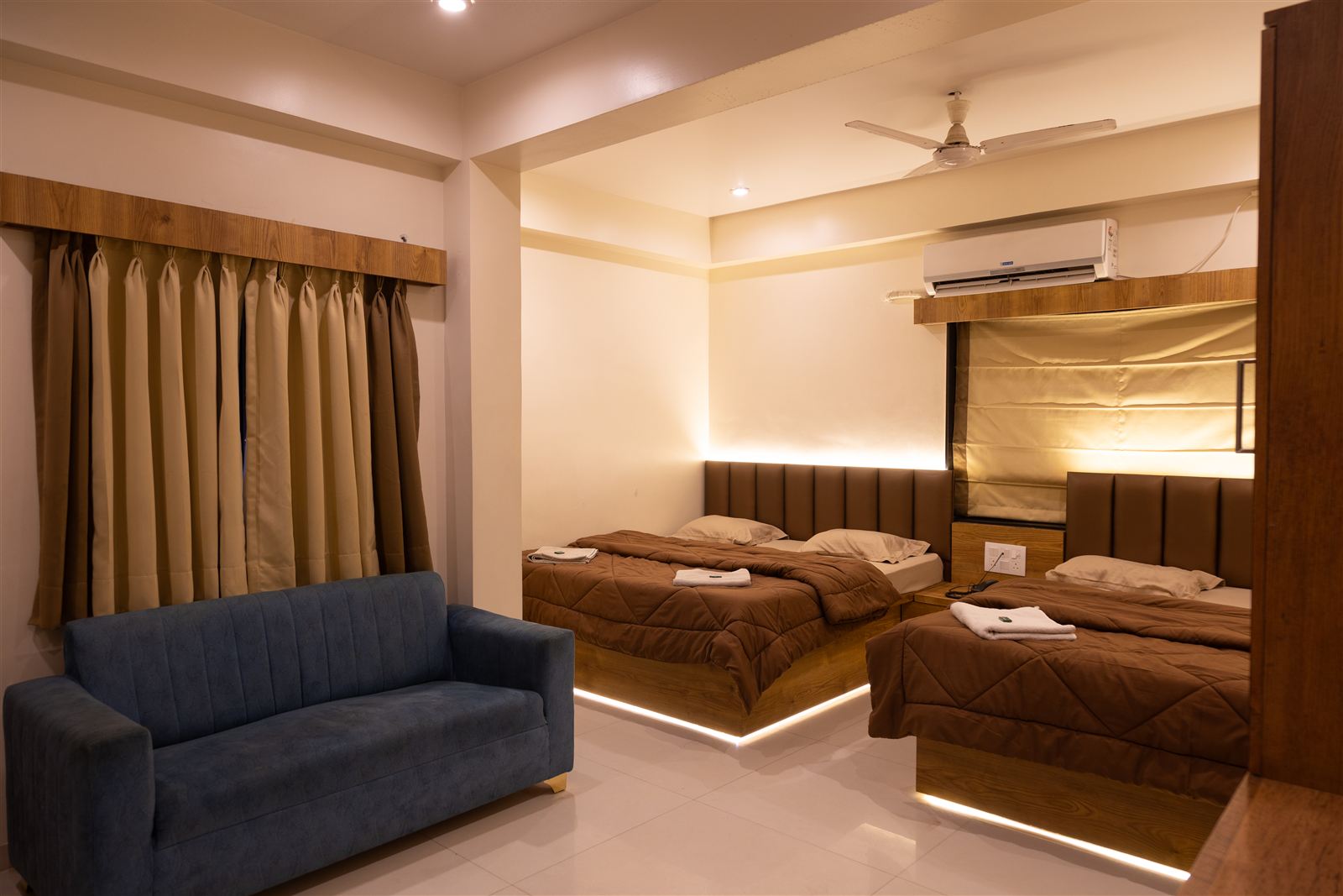 Four bed deluxe room with sofa seating